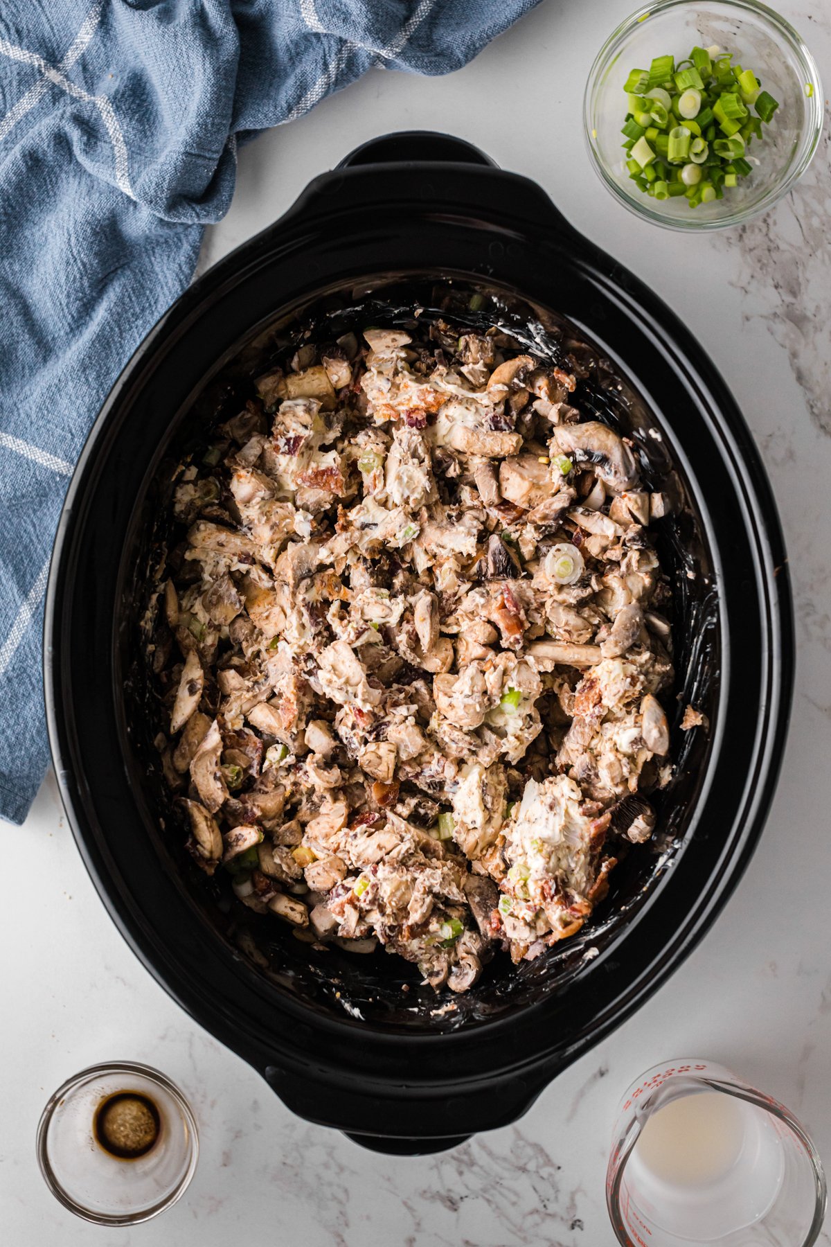 Mushroom dip mixed together before cooking in a crockpot.
