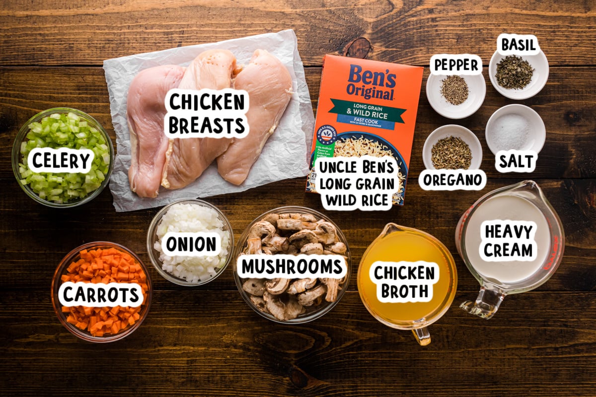 Ingredients for slow cooker wild rice chicken soup on a table.