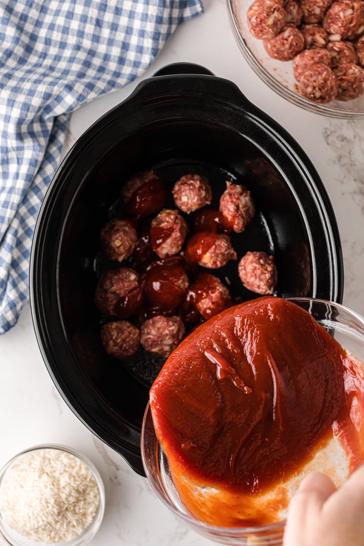 Pour sauce mixture onto meatballs in a slow cooker.
