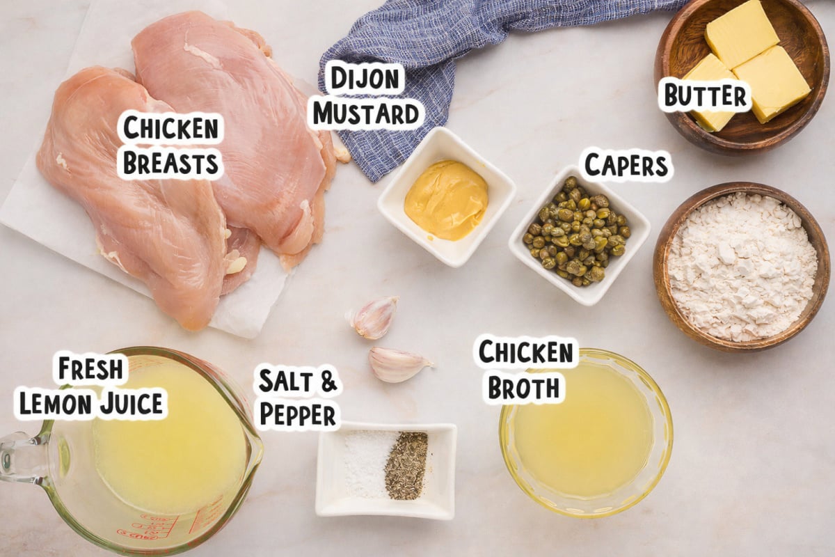Ingredients for chicken piccata on a table.