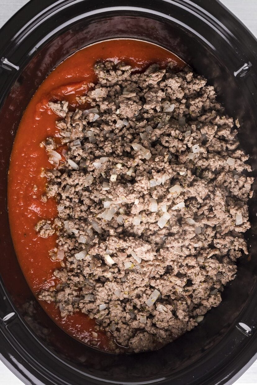 ground beef and sauce in a slow cooker.