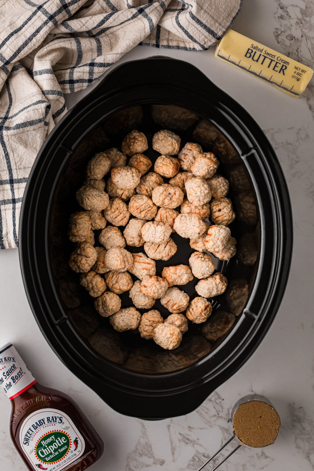 Frozen meatballs in a crockpot.