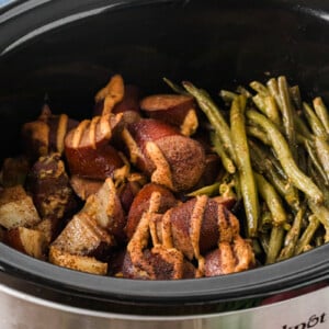 Kielbasa, green beans, and potatoes in a crockpot after cooking.