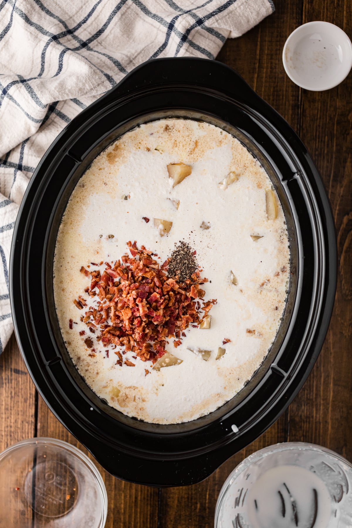 Chopped bacon added to soup in a crockpot.