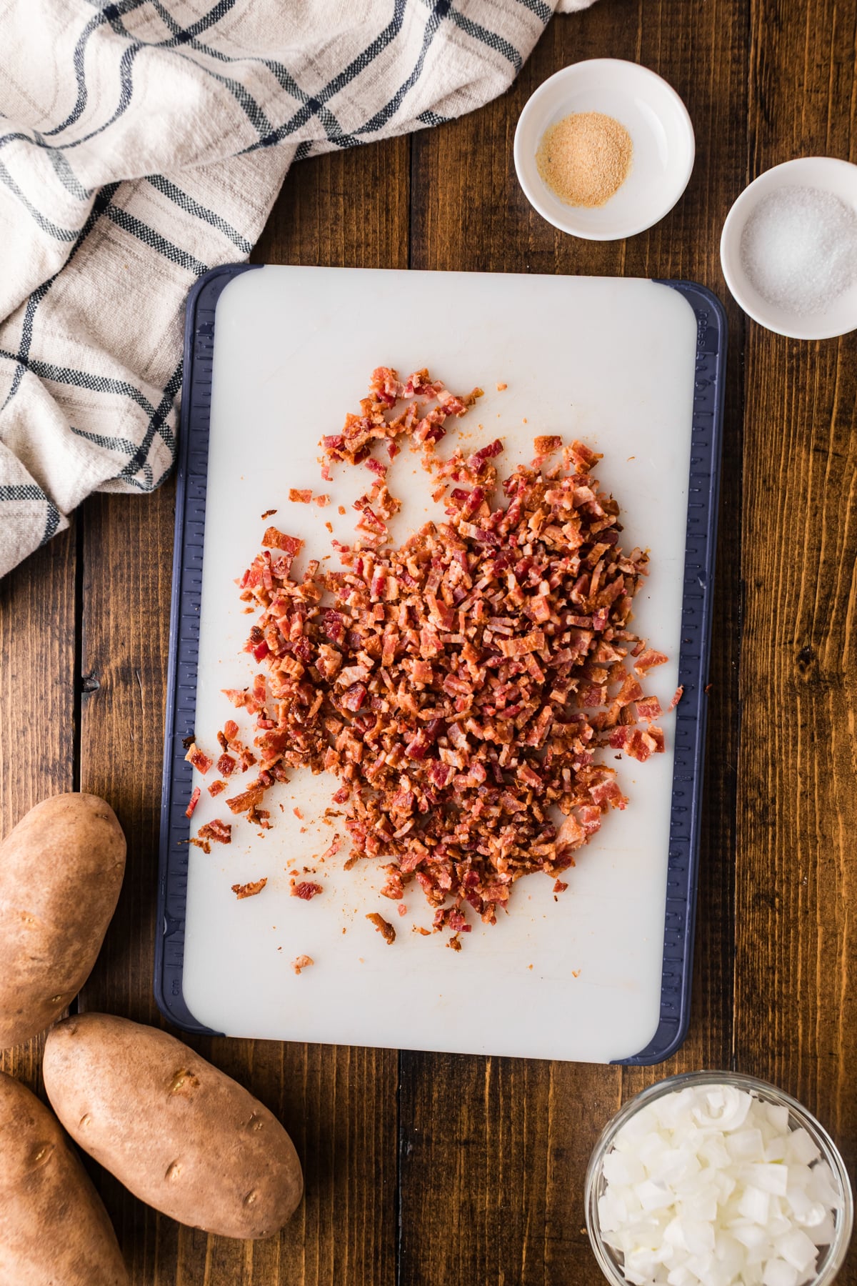 Chopped bacon on a cutting board.