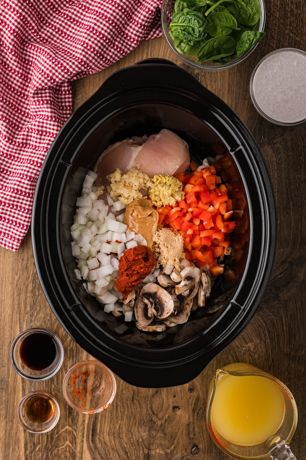 Ingredients for thai red curry chicken souop in a crockpot.