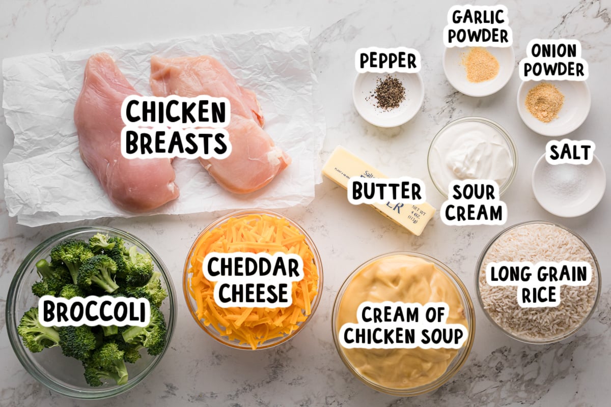 Ingredients for chicken broccoli and rice on a table.